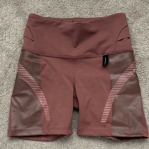 Athleta Allyson Felix Legend Shortie shorts in the Hearth Rose color.